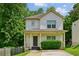 Charming two-story home with a covered front porch and fresh landscaping at 55 Bowen Ave, Atlanta, GA 30315