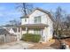 Quaint two-story home featuring a covered porch, complemented by mature trees and natural surroundings at 55 Bowen Ave, Atlanta, GA 30315