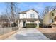 Inviting two-story home with a covered porch and well-maintained landscaping, with an extra long driveway at 55 Bowen Ave, Atlanta, GA 30315