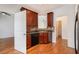 The eat-in kitchen features stainless steel appliances, wood cabinets, and hardwood flooring at 55 Bowen Ave, Atlanta, GA 30315