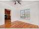 Living room space with hardwood flooring next to the kitchen and window at 55 Bowen Ave, Atlanta, GA 30315