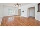 Bright living room with hardwood floors, ceiling fan, and large window letting in natural light at 55 Bowen Ave, Atlanta, GA 30315