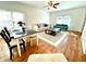 Open-concept living room with hardwood floors, ample natural light, and stylish furnishings at 55 Bowen Ave, Atlanta, GA 30315