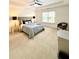 Spacious main bedroom with a king bed, tray ceiling, neutral color palette, and comfortable furnishings at 55 Bowen Ave, Atlanta, GA 30315