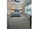 Spacious main bedroom with a king bed, tray ceiling, neutral color palette, and comfortable furnishings at 55 Bowen Ave, Atlanta, GA 30315
