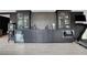 Stylish bar area equipped with modern appliances, custom cabinetry, and beverage storage at 13 Highland Park Ne Ln, Atlanta, GA 30306