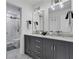 Elegant bathroom with double vanity, granite countertops, and a glass-enclosed shower at 13 Highland Park Ne Ln, Atlanta, GA 30306