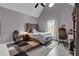 Spacious bedroom with vaulted ceiling, cozy carpet, and dedicated desk space near the window at 13 Highland Park Ne Ln, Atlanta, GA 30306