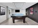 Bright and spacious billiards room with modern lighting and decor features a Diamond pool table at 13 Highland Park Ne Ln, Atlanta, GA 30306