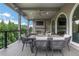 Enjoy outdoor dining on this covered deck with a fireplace and comfortable seating at 13 Highland Park Ne Ln, Atlanta, GA 30306