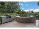 Entertain on this outdoor deck with an outdoor grill, comfortable seating and fantastic views at 13 Highland Park Ne Ln, Atlanta, GA 30306