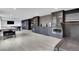 Spacious game room features a pool table, bar area with custom cabinets, and sleek tiled flooring at 13 Highland Park Ne Ln, Atlanta, GA 30306