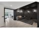 Inviting home theater room with a sectional sofa and adjacent billiards room at 13 Highland Park Ne Ln, Atlanta, GA 30306