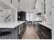 Contemporary kitchen with stainless steel appliances, an island with bar stools, and sleek countertops at 13 Highland Park Ne Ln, Atlanta, GA 30306