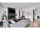 Open-concept living room with fireplace, TV, and access to other rooms in the home at 13 Highland Park Ne Ln, Atlanta, GA 30306