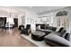 Open-concept living room showcasing hardwood floors, comfortable seating, and seamless flow into the kitchen at 13 Highland Park Ne Ln, Atlanta, GA 30306