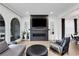Living room featuring a fireplace, mounted TV, and comfortable seating at 13 Highland Park Ne Ln, Atlanta, GA 30306