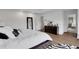 Bright main bedroom features a large window, hardwood floors, and ensuite bathroom access at 13 Highland Park Ne Ln, Atlanta, GA 30306