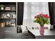 Close up of office nook with built-ins, throw pillows, and decorative vase with flowers at 13 Highland Park Ne Ln, Atlanta, GA 30306