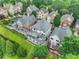 Aerial view showcasing home exteriors with multiple decks and patios, surrounded by mature trees in a lush setting at 13 Highland Park Ne Ln, Atlanta, GA 30306