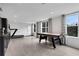 Recreation area features a treadmill and an air hockey table with city views in the distance at 13 Highland Park Ne Ln, Atlanta, GA 30306