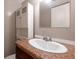 Bathroom vanity featuring a white sink, stylish mirror, and ample storage at 134 Timber Creek Sw Ln, Marietta, GA 30060