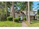Charming townhouse with stone accents and mature trees surrounding the landscaped front yard at 134 Timber Creek Sw Ln, Marietta, GA 30060