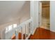 Hallway featuring hardwood floors and an open bathroom with a tub in the background at 134 Timber Creek Sw Ln, Marietta, GA 30060