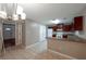 Bright kitchen featuring tile floors, white appliances, and dark wood cabinets at 134 Timber Creek Sw Ln, Marietta, GA 30060