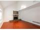 Bright living room featuring vaulted ceiling, wood floors, and a cozy stone fireplace at 134 Timber Creek Sw Ln, Marietta, GA 30060