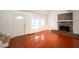 Inviting living room with wood flooring and a cozy stone fireplace next to the front door at 134 Timber Creek Sw Ln, Marietta, GA 30060