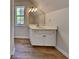 A bathroom includes a single vanity and natural light at 1704 Yarborough Dr, Peachtree City, GA 30269
