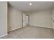 Carpeted bedroom features neutral paint and an open doorway to the ensuite bathroom at 1704 Yarborough Dr, Peachtree City, GA 30269