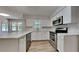 Open kitchen with stainless steel appliances, white countertops, and an island at 1704 Yarborough Dr, Peachtree City, GA 30269