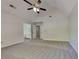A vaulted ceiling and neutral carpet grace the main bedroom at 1704 Yarborough Dr, Peachtree City, GA 30269