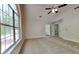 Spacious main bedroom features a ceiling fan, neutral carpet, and a bright window at 1704 Yarborough Dr, Peachtree City, GA 30269