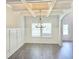 Bright dining room with coffered ceilings and wainscoting provides an elegant space for meals at 195 Silvercrest Dr, Acworth, GA 30101