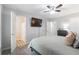 Bedroom with ceiling fan, TV, and an ensuite bathroom for modern comfort at 2038 Summertown Dr, Norcross, GA 30071