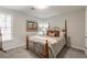 Bedroom with four-poster bed, soft carpet, and lots of natural light at 2038 Summertown Dr, Norcross, GA 30071