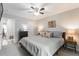 Comfortable bedroom with gray walls, carpet, ceiling fan, and neutral bedding at 2038 Summertown Dr, Norcross, GA 30071