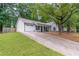 Well-maintained home featuring a two-car garage and a landscaped front yard at 2038 Summertown Dr, Norcross, GA 30071