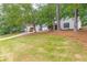 Attractive home with a well-manicured lawn and mature trees at 2038 Summertown Dr, Norcross, GA 30071