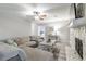 Cozy living room featuring a large sectional, stone fireplace, and stylish decor at 2038 Summertown Dr, Norcross, GA 30071