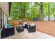 Outdoor patio with elegant furniture and a lush backyard at 2038 Summertown Dr, Norcross, GA 30071