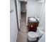 Compact bathroom has a single sink vanity and nearby toilet at 300 Old Boy Scout Rd, Whitesburg, GA 30185