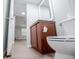 Bathroom features vanity with dark cabinet and a toilet at 300 Old Boy Scout Rd, Whitesburg, GA 30185