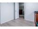 View from a bedroom into an adjoining bathroom with grey walls and wood-look flooring at 300 Old Boy Scout Rd, Whitesburg, GA 30185