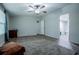 Spacious bedroom with ceiling fan, wood-look flooring, and an open doorway to an adjacent room at 300 Old Boy Scout Rd, Whitesburg, GA 30185