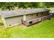 Exterior of the home features a long deck, a well-maintained lawn, and access to outdoor spaces at 300 Old Boy Scout Rd, Whitesburg, GA 30185