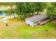 Exterior of home shows lush lawn, deck, and proximity to the pond at 300 Old Boy Scout Rd, Whitesburg, GA 30185